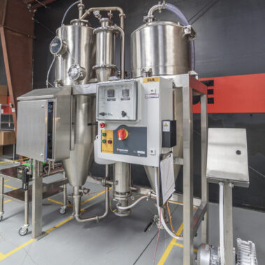 A complete industrial spray dryer system from Pulse Combustion Systems, showcasing the stainless steel construction and advanced controls of our spray drying equipment.